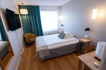 Фото номера Двухместный номер «Комфорт» с 1 кроватью Отель Hotel Hirvi г. Ээнекоски 6