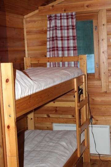 Фото номера Коттедж с сауной (Harmaa Hukka) Дома для отпуска Accommodation and Fishing Vonkale г. Ээнекоски 14